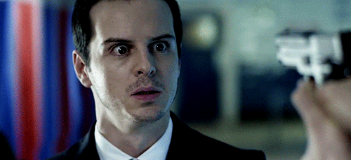 GIF image of Moriarty, from BBC Sherlock, making a mock-surprise face.